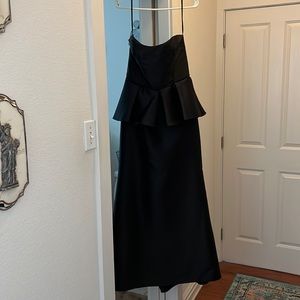 Brand new, never worn black formal gown with peplum.